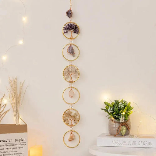 Add a touch of tranquility and positive energy to your living space with the Life Tree Crystal Wall Hanging Decor. This beautifully designed piece features 6 rings adorned with 7 chakra healing crystals including Amethyst, Aquamarine, and more, known for their calming and concentration-enhancing properties. Double Cart provides best Home decor, Wall art , Gifts and lighting accessories in Houston metro area.