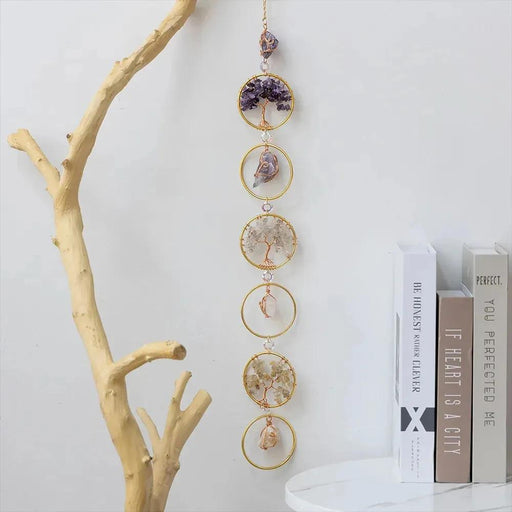Add a touch of tranquility and positive energy to your living space with the Life Tree Crystal Wall Hanging Decor. This beautifully designed piece features 6 rings adorned with 7 chakra healing crystals including Amethyst, Aquamarine, and more, known for their calming and concentration-enhancing properties. Double Cart provides best Home decor, Wall art , Gifts and lighting accessories in Nashville metro area.