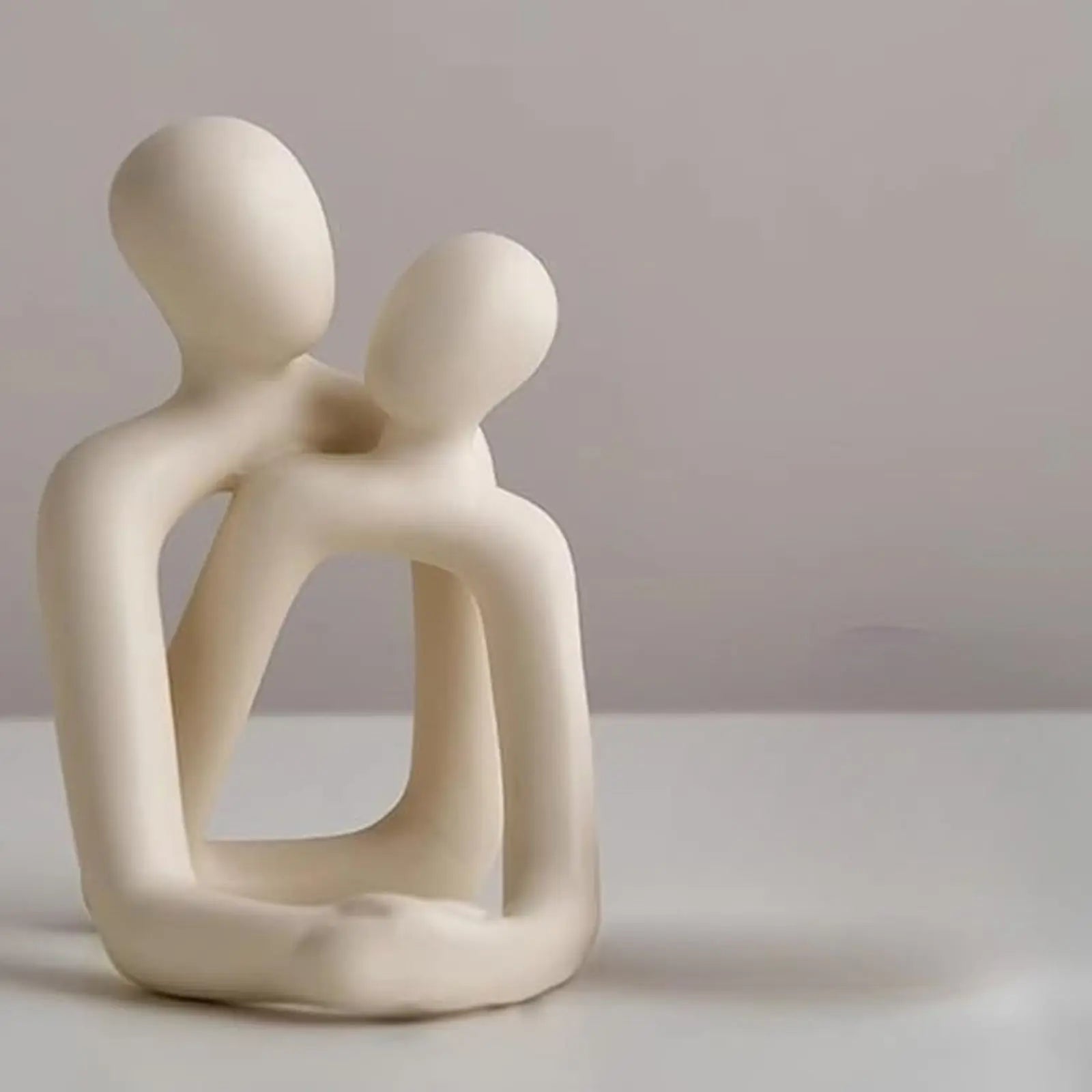 This Modern Resin Loving Couple Statue is a stylish addition to your home decor collection. Double Cart provides Best products for your home in Charlotte, NC.
